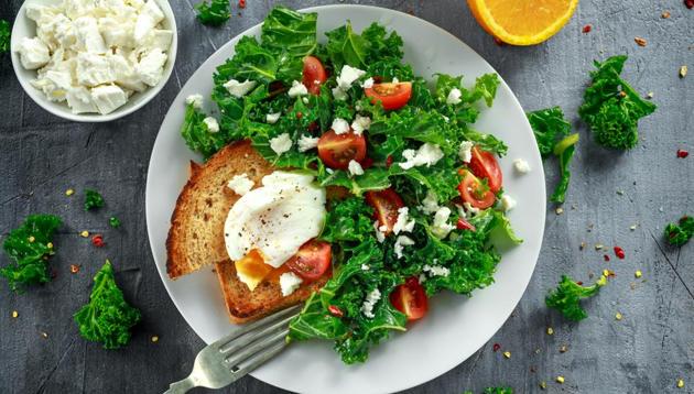 Kale with poached eggs; both contain the nutrient lutein which helps in cognitive function.(Shutterstock)