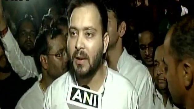 Tejashwi Yadav led a large group of RJD leaders and supporters to the Raj Bhavan.(ANI Photo)