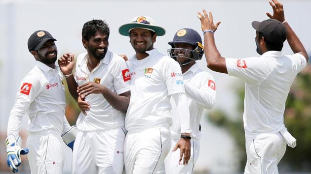 Nuwan Pradeep celebrates with his Sri Lankan teammates after taking an Indian wicket in the first cricket Test at Galle on Thursday. (REUTERS) Nuwan Pradeep celebrates with his Sri Lankan teammates after taking an Indian wicket in the first cricket Test at Galle on Thursday. (REUTERS)