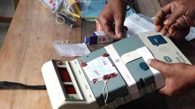 Election commission officials seal an Electronic Voting Machine (EVM) before the start of voting at a polling station in Assam. (AFP File) Election commission officials seal an Electronic Voting Machine (EVM) before the start of voting at a polling station in Assam. (AFP File)
