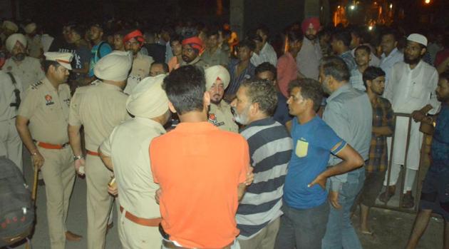 People from the community holding a protest and blocking the road at Basti Jodhewal in Ludhiana on Thursday. (HT Photo) People from the community holding a protest and blocking the road at Basti Jodhewal in Ludhiana on Thursday. (HT Photo)