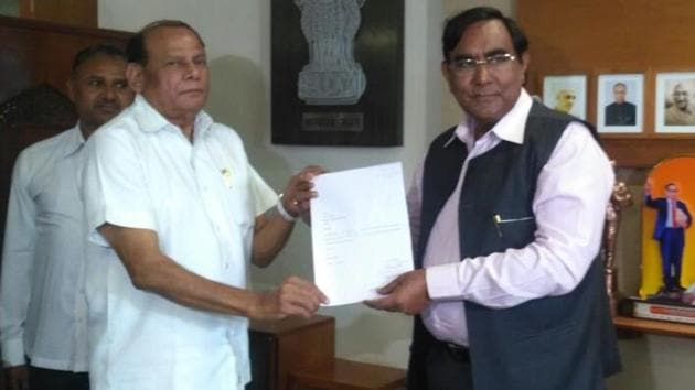 Gujarat Congress MLA Ramsinh Parmar submits his resignation to the assembly speaker on Friday. (Photo: ANI Twitter)