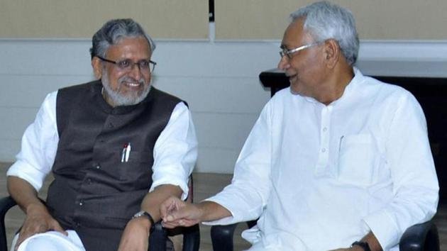 Bihar chief minister Nitish Kumar with senior BJP leader Sushil Kumar Modi at legislators meeting in Patna on Wednesday.(PTI)