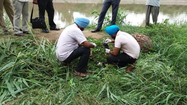 Police officials during the search operation in Kangna village in SBS Nagar district on Thursday.(HT Photo)