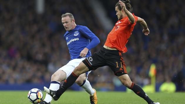 Everton's Wayne Rooney, left, and Ruzomberok's Matej Kochan battle for the ball during the Europa League Qualifying Third Round, First Leg football match at Goodison Park, Liverpool, on Thursday. (AP) Everton's Wayne Rooney, left, and Ruzomberok's Matej Kochan battle for the ball during the Europa League Qualifying Third Round, First Leg football match at Goodison Park, Liverpool, on Thursday. (AP)