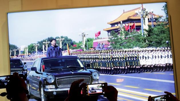 People take smartphone pictures of a display photo showing Chinese President Xi Jinping inspecting the army at the 2015 military parade, at the military museum in Beijing, Thursday. (AP Photo) People take smartphone pictures of a display photo showing Chinese President Xi Jinping inspecting the army at the 2015 military parade, at the military museum in Beijing, Thursday. (AP Photo)