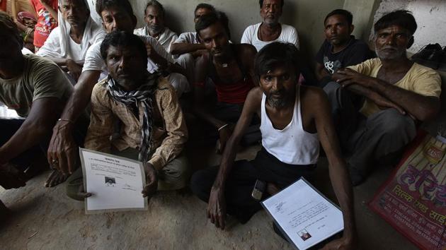 Mine workers show their Silicosis Certificates in Rajasthan, India. The Employee’s Compensation Act, 1923 recognises the risk of silicosis as an occupational hazard, mandating compensation for afflicted workers. Despite an amended law passed by Lok Sabha last year, workers struggle for compensation, saddled with the onus of diagnosis and then proving links to an occupational hazard. (Raj K Raj / HT Photo)