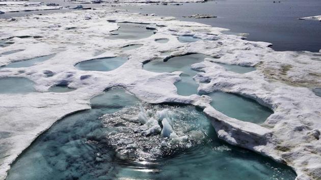 Ice is broken up by the passing of the MSV Nordica as it sails through the Chukchi Sea. The region has become a magnet for nations wanting to exploit the Arctic’s rich oil reserves and other natural resources and for scientists seeking to understand global warming and its impacts on the sea and wildlife. (David Goldman / AP)