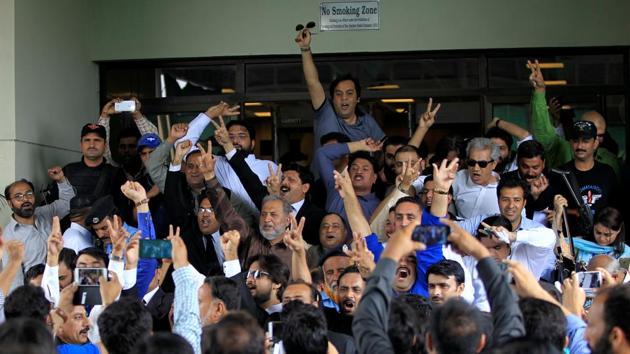 Opponents of Prime Minister Nawaz Sharif raise slogans as they exit the Supreme Court in Islamabad, Pakistan. Announcing the verdict, judge Ejaz Afzal Khan said, ‘He is no more eligible to be an honest member of the parliament,’. (Caren Firouz / REUTERS) Opponents of Prime Minister Nawaz Sharif raise slogans as they exit the Supreme Court in Islamabad, Pakistan. Announcing the verdict, judge Ejaz Afzal Khan said, ‘He is no more eligible to be an honest member of the parliament,’. (Caren Firouz / REUTERS)