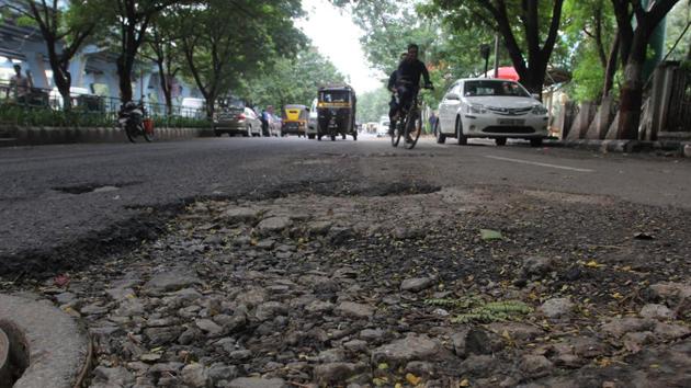 Potholes at Mangal Pandey Service Road near Cadbury Junction in Thane on Friday (Praful Gangurde) Potholes at Mangal Pandey Service Road near Cadbury Junction in Thane on Friday (Praful Gangurde)