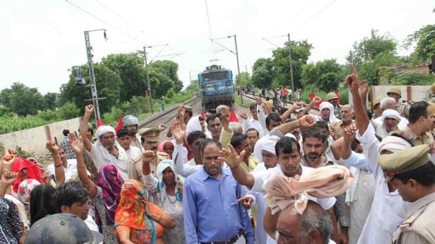 Farmers sat on a protest at Bodaki village, blocking Delhi-Howrah railway line on Friday. (HT Photo) Farmers sat on a protest at Bodaki village, blocking Delhi-Howrah railway line on Friday. (HT Photo)