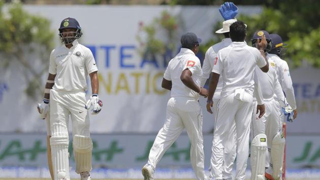 India did not start well in their second innings as opener Shikhar Dhawan (L) was dismissed early on. (AP) India did not start well in their second innings as opener Shikhar Dhawan (L) was dismissed early on. (AP)