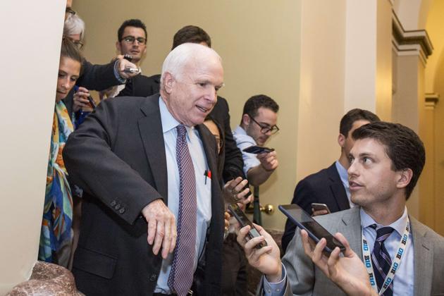 US senator John McCain leaves the Senate Chamber after voting against a stripped-down version of Obamacare on July 28, 2017. (AFP) US senator John McCain leaves the Senate Chamber after voting against a stripped-down version of Obamacare on July 28, 2017. (AFP)
