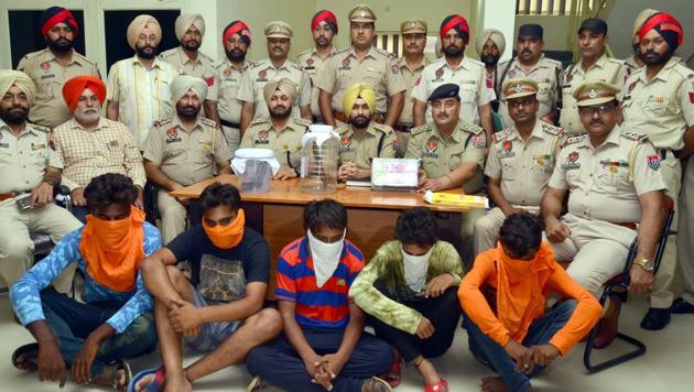 Police officials presenting the accused during a press conference in Amritsar on Friday. (Sameer Sehgal/HT) Police officials presenting the accused during a press conference in Amritsar on Friday. (Sameer Sehgal/HT)