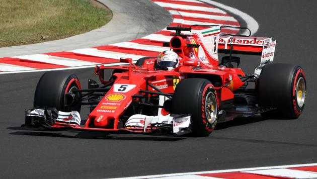 Ferrari's German driver Sebastian Vettel drives during the free practice session at the ahead of the Formula One Hungarian Grand Prix. (AFP) Ferrari's German driver Sebastian Vettel drives during the free practice session at the ahead of the Formula One Hungarian Grand Prix. (AFP)