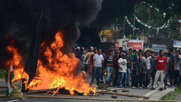 Supporters of separate Gorkhaland stand by a blazing road block during clashes with police in Sukna village on the outskirts of Siliguri on Saturday. (AFP) Supporters of separate Gorkhaland stand by a blazing road block during clashes with police in Sukna village on the outskirts of Siliguri on Saturday. (AFP)