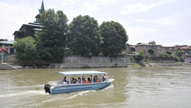 A motor-boat, issued by the government for trial run of waterway transportation on the Jhelum, moves past the Shah-e-Hamadan shrine in Srinagar .(Waseem Andrabi / HT Photo) A motor-boat, issued by the government for trial run of waterway transportation on the Jhelum, moves past the Shah-e-Hamadan shrine in Srinagar .(Waseem Andrabi / HT Photo)