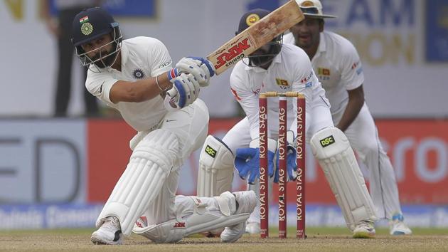 Indian cricket captain Virat Kohli plays a shot during the fourth day's play of the first test cricket match between India and Sri Lanka in Galle. (AP) Indian cricket captain Virat Kohli plays a shot during the fourth day's play of the first test cricket match between India and Sri Lanka in Galle. (AP)