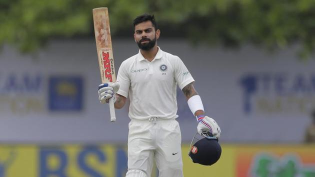 Virat Kohli celebrates after scoring his 17th Test century during the fourth day of the first test match between India and Sri Lanka. (AP) Virat Kohli celebrates after scoring his 17th Test century during the fourth day of the first test match between India and Sri Lanka. (AP)