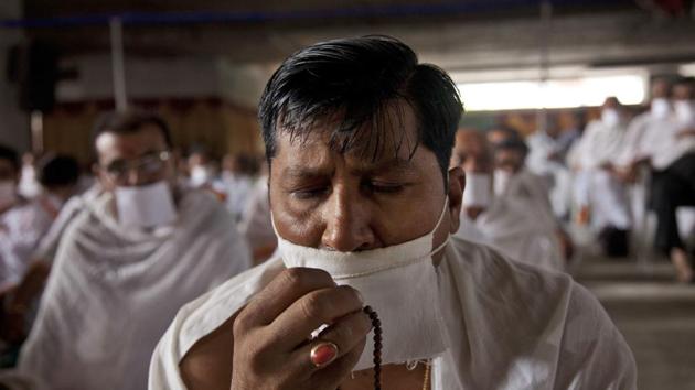 An Indian Jain community member holds prayers beads as he gathers in support of members of their community who have been on a symbolic “Fasting for world Peace’’ for the past eight days in Hyderabad Monday, July 24. (AP/Mahesh Kumar A) An Indian Jain community member holds prayers beads as he gathers in support of members of their community who have been on a symbolic “Fasting for world Peace’’ for the past eight days in Hyderabad Monday, July 24. (AP/Mahesh Kumar A)