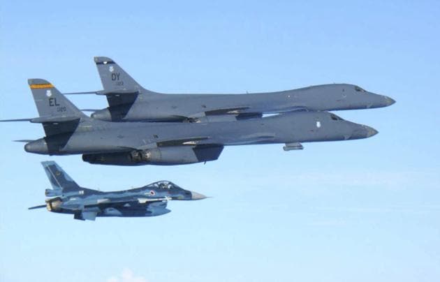 US Air Force B-1B bombers (top) fly with a Japan Air Self Defence Force F-2 fighter jet over Japan's southern island of Kyushu, just south of the Korean Peninsula, during a Japan-US joint exercise on Sunday.(AP) US Air Force B-1B bombers (top) fly with a Japan Air Self Defence Force F-2 fighter jet over Japan's southern island of Kyushu, just south of the Korean Peninsula, during a Japan-US joint exercise on Sunday.(AP)
