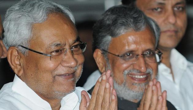 Bihar chief minister Nitish Kumar with his new deputy, Shushil Kumar Modi of the BJP, at a ceremony to swear in his ministerial team in Patna on Saturday. (AP Dube / HT photo) Bihar chief minister Nitish Kumar with his new deputy, Shushil Kumar Modi of the BJP, at a ceremony to swear in his ministerial team in Patna on Saturday. (AP Dube / HT photo)