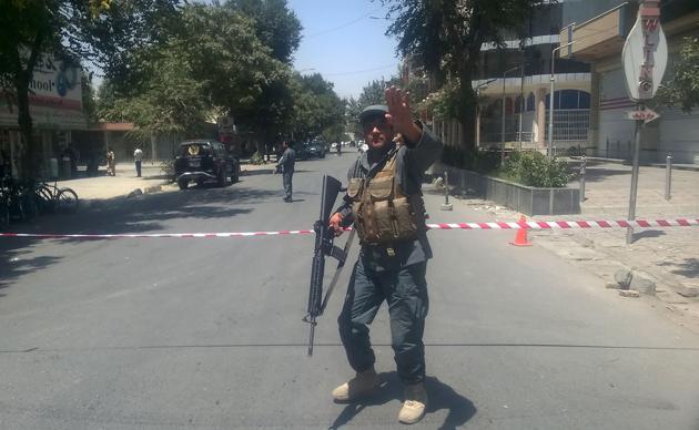 An Afghan policeman sets up a perimeter at the site of an explosion in Kabul. (AFP Photo) An Afghan policeman sets up a perimeter at the site of an explosion in Kabul. (AFP Photo)