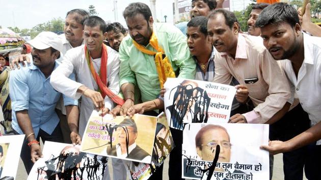 BJP supporters pour black ink over posters of former Uttar Pradesh minister Azam Khan in Patna after he made statements against the Indian Army. (PTI Photo) BJP supporters pour black ink over posters of former Uttar Pradesh minister Azam Khan in Patna after he made statements against the Indian Army. (PTI Photo)