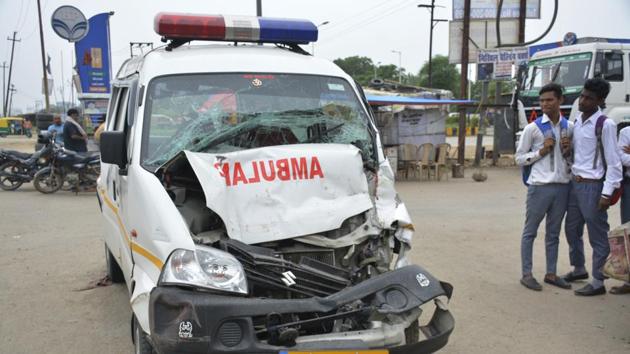 The ambulance overturned after it was trapped between two other vehicles near a petrol pump on the national highway. (Sakib Ali/HT Photo) The ambulance overturned after it was trapped between two other vehicles near a petrol pump on the national highway. (Sakib Ali/HT Photo)