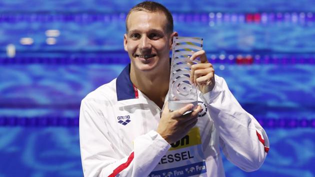United States' Caeleb Dressel ,who won 7 gold medals, shows off the award as best male athlete during the FINA World Championships. (AP) United States' Caeleb Dressel ,who won 7 gold medals, shows off the award as best male athlete during the FINA World Championships. (AP)