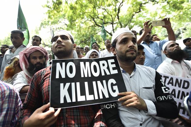 Protesters hold placards as they participate in a sit-in over a spate of assaults against Muslims and low-caste Dalits by Hindu vigilantes, New Delhi, July 18 (Burhaan Kinu/HT PHOTO) Protesters hold placards as they participate in a sit-in over a spate of assaults against Muslims and low-caste Dalits by Hindu vigilantes, New Delhi, July 18 (Burhaan Kinu/HT PHOTO)