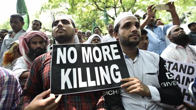Protesters hold placards during a sit-in over assaults against Muslims and Dalits. (Burhaan Kinu/HT PHOTO) Protesters hold placards during a sit-in over assaults against Muslims and Dalits. (Burhaan Kinu/HT PHOTO)