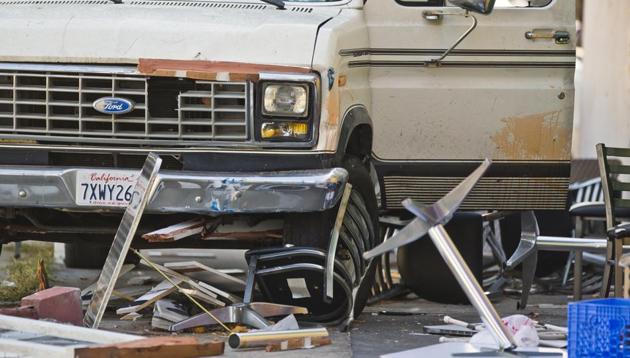 Broken restaurant tables and chairs are seen under a van that plowed into a group of people dining on a Los Angeles sidewalk injuring several Sunday, July 30, 2017. (AP Photo) Broken restaurant tables and chairs are seen under a van that plowed into a group of people dining on a Los Angeles sidewalk injuring several Sunday, July 30, 2017. (AP Photo)