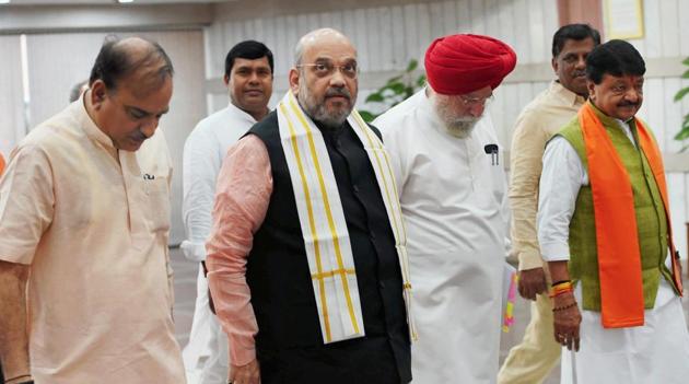 BJP president Amit Shah, Parliamentary affairs minister Ananth Kumar (left), and minister of state SS Ahluwalia arrive to attend BJP parliamentary party meeting, in New Delhi on Tuesday. (PTI Photo) BJP president Amit Shah, Parliamentary affairs minister Ananth Kumar (left), and minister of state SS Ahluwalia arrive to attend BJP parliamentary party meeting, in New Delhi on Tuesday. (PTI Photo)