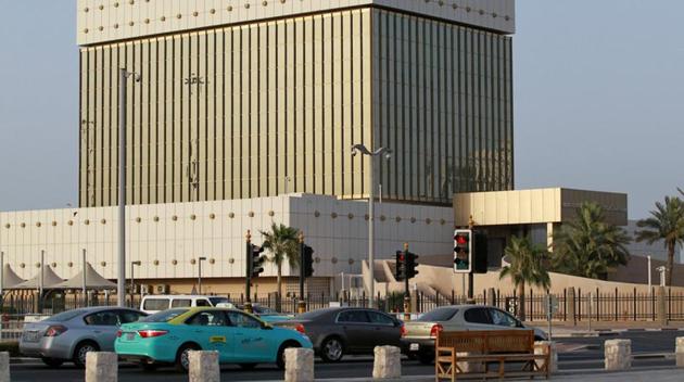 Cars drive past the building of Qatar Central Bank in Doha. (REUTERS) Cars drive past the building of Qatar Central Bank in Doha. (REUTERS)