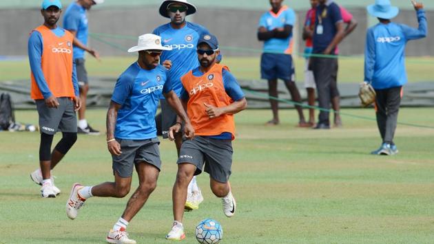 Shikhar Dhawan plays football with his teammates before the nets sessions began in earnest. (AFP)