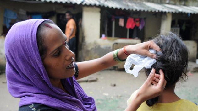 A woman shows her daughter’s braids that were allegedly chopped on Monday night in Ravi Nagar, Gurgaon. (Parveen Kumar/ht photo) A woman shows her daughter’s braids that were allegedly chopped on Monday night in Ravi Nagar, Gurgaon. (Parveen Kumar/ht photo)