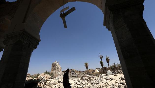 A member of Iraq's Counter-Terrorism Service walks in the rubble near the destroyed ancient leaning minaret, known as the "Hadba" (Hunchback), in Mosul's old city on July 30, 2017.(AFP) A member of Iraq's Counter-Terrorism Service walks in the rubble near the destroyed ancient leaning minaret, known as the "Hadba" (Hunchback), in Mosul's old city on July 30, 2017.(AFP)
