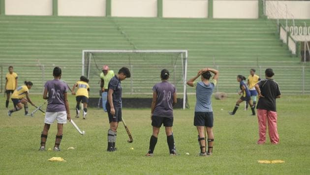 Young hockey players polishing their skills on grass instead of astroturf. (HT Photo) Young hockey players polishing their skills on grass instead of astroturf. (HT Photo)