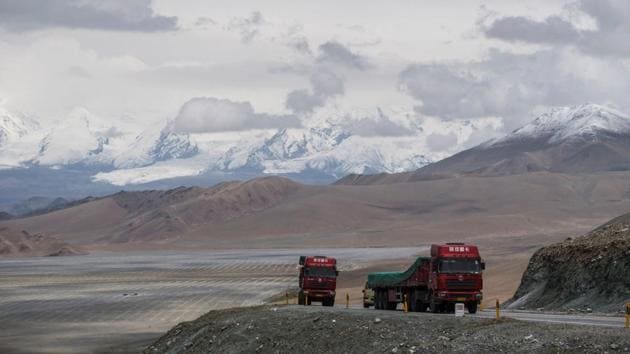 In June, on the 300 kilometre trip between Kashgar and Tashkurgan, drivers were stopped at six police checkpoints, while their passengers had to walk through metal detectors and show identification cards. Signs warn that officials can check mobile phones for ‘illegal’  religious content. (Johannes EISELE / AFP) 