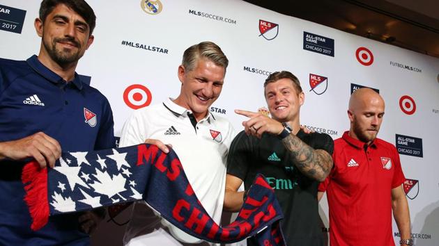 Real Madrid C.F. midfielder Toni Kross (2nd right) shares a light moment with Chicago Fire midfielder Bastian Schweinsteiger (2nd left) during a joint press conference on the eve of the match between the Spanish giants and Major League Soccer (MLS) All Star team at Soldier Field in Chicago.(Reuters)