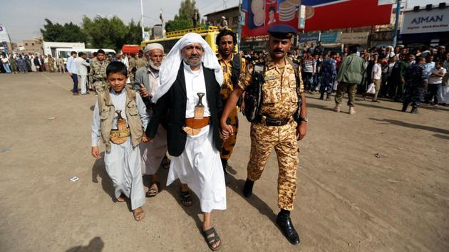 Yahya al-Matari (C) walks at the site of the execution of Muhammad al-Maghrabi, 41, who was convicted of raping al-Matari's three-year-old daughter. He told reporters present at the execution ‘This is the first day in my life’, adding ‘I am relieved now.’ (Khaled Abdullah / REUTERS)
