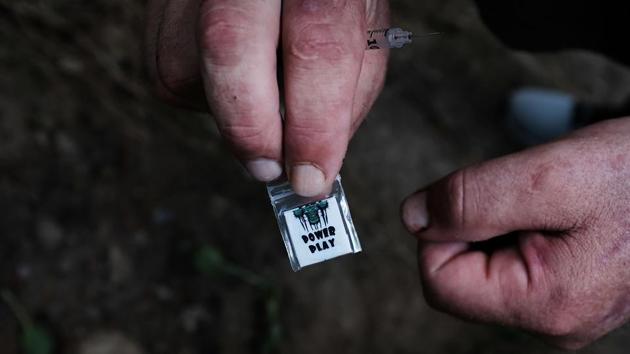 Chris, a homeless heroin addict displays a brand of heroin called ‘power play’ available on the streets for $5. The report also sheds light on the fact that four out of every five eventual heroin users begin with non medical use of prescription pills. (Spencer Platt / Getty Images / AFP) Chris, a homeless heroin addict displays a brand of heroin called ‘power play’ available on the streets for $5. The report also sheds light on the fact that four out of every five eventual heroin users begin with non medical use of prescription pills. (Spencer Platt / Getty Images / AFP)