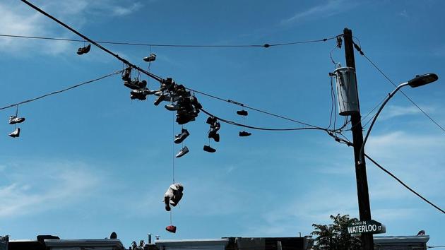 Sneakers hang from phone lines --a symbol often associated with areas of drug and gang influence -- in Kensington, Philadelphia. Figures presented by the Centers for Disease Control (CDC) show that between 1999 and 2015, more than 560,000 lives were lost to overdoses -- a figure larger than the entire population of the city of Atlanta, Georgia. (Spencer Platt / Getty Images / AFP) Sneakers hang from phone lines --a symbol often associated with areas of drug and gang influence -- in Kensington, Philadelphia. Figures presented by the Centers for Disease Control (CDC) show that between 1999 and 2015, more than 560,000 lives were lost to overdoses -- a figure larger than the entire population of the city of Atlanta, Georgia. (Spencer Platt / Getty Images / AFP)