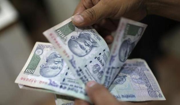 The rupee opened at 64.12 a dollar and touched a high of 63.60. So far this year it gained over 6.5%. (REUTERS) The rupee opened at 64.12 a dollar and touched a high of 63.60. So far this year it gained over 6.5%. (REUTERS)