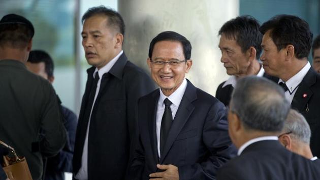 Thailand's former Prime Minister Somchai Wongsawat, center, smilies upon his arrival at a courthouse Wednesday, Aug. 2, 2017, in Bangkok, Thailand. (AP Photo) Thailand's former Prime Minister Somchai Wongsawat, center, smilies upon his arrival at a courthouse Wednesday, Aug. 2, 2017, in Bangkok, Thailand. (AP Photo)