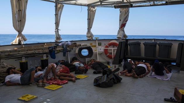 Migrants from Libya sleep on deck of the Aquarius rescue ship run by NGO SOS Mediterranee and Medecins Sans Frontieres (MSF) after their rescue, in the Mediterranean Sea on August 2. (AFP Photo) Migrants from Libya sleep on deck of the Aquarius rescue ship run by NGO SOS Mediterranee and Medecins Sans Frontieres (MSF) after their rescue, in the Mediterranean Sea on August 2. (AFP Photo)