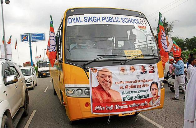 A school bus ferrying people to a BJP rally to welcome Amit Shah in Rohtak on Wednesday.(HT File)