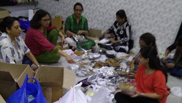 Members of Food Army sorting through thepla packets at founder Rintu Rathod’s house in Santacruz (West) on Wednesday.