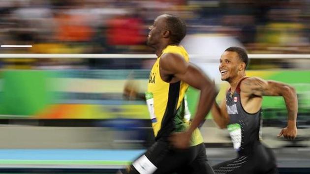 Usain Bolt and Andre De Grasse during the 200m semifinal at the Rio Olympics last year (file photo).(Reuters)